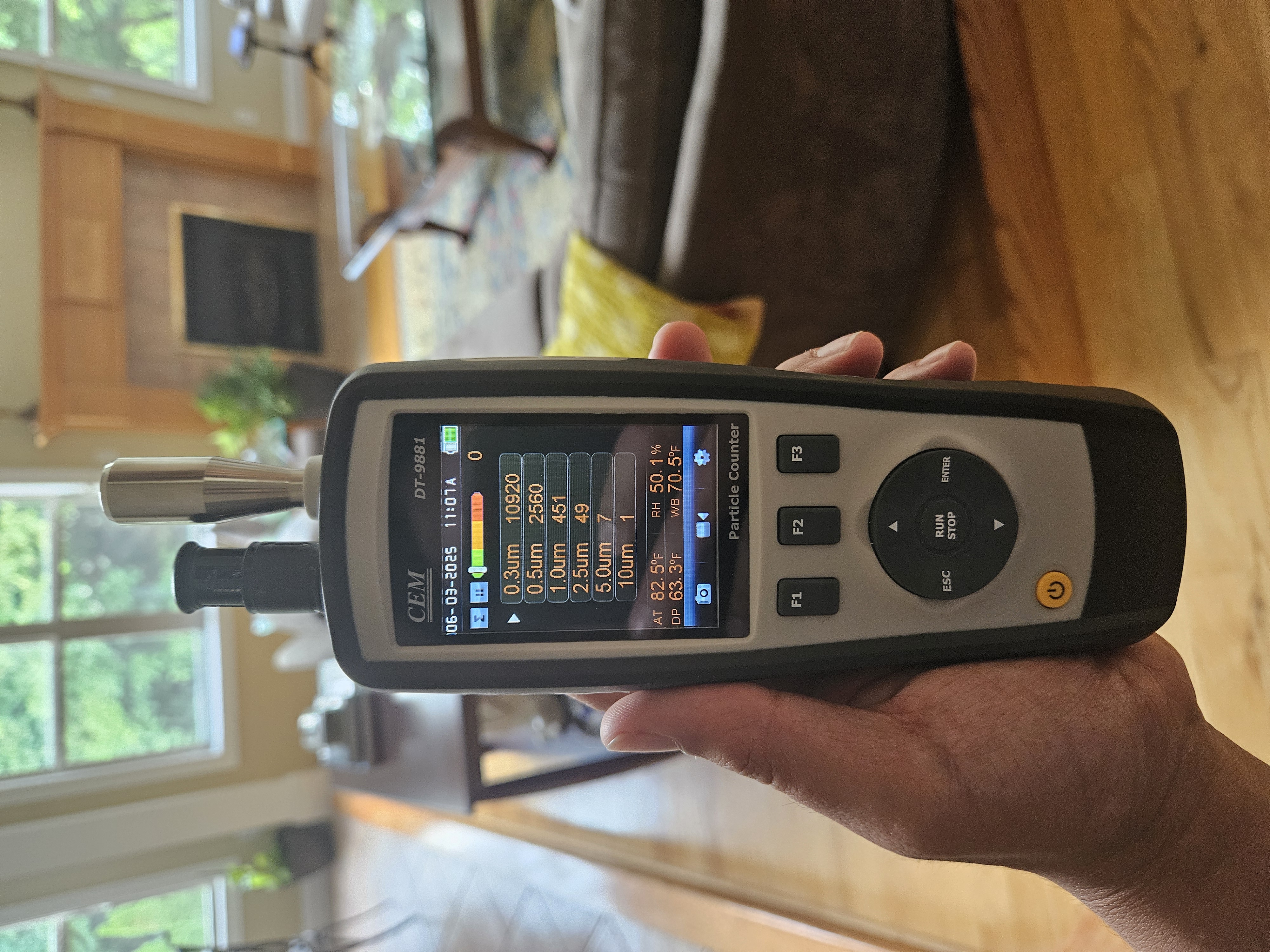 Handheld particle counter measuring indoor air particle load